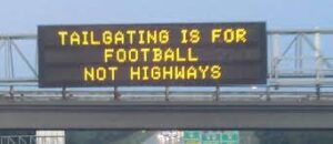 An electronic message sign from a highway. It says that tailgating should be left at he party, not on the road.